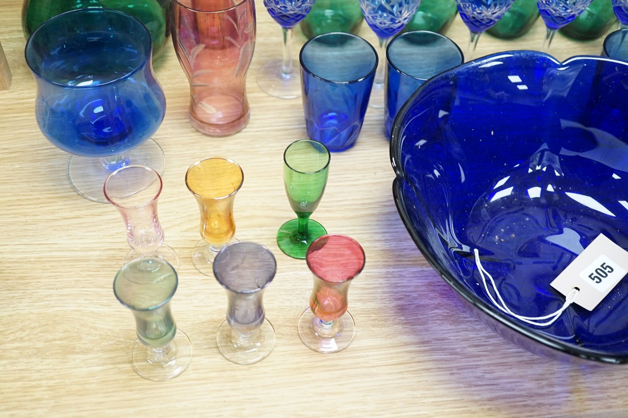 A mixed group of coloured glassware